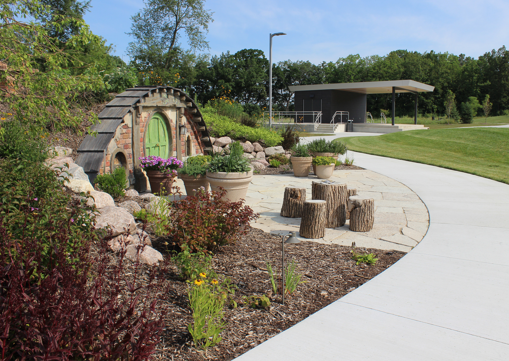 Photograph of the hobbit inspired berm with the stage in the background