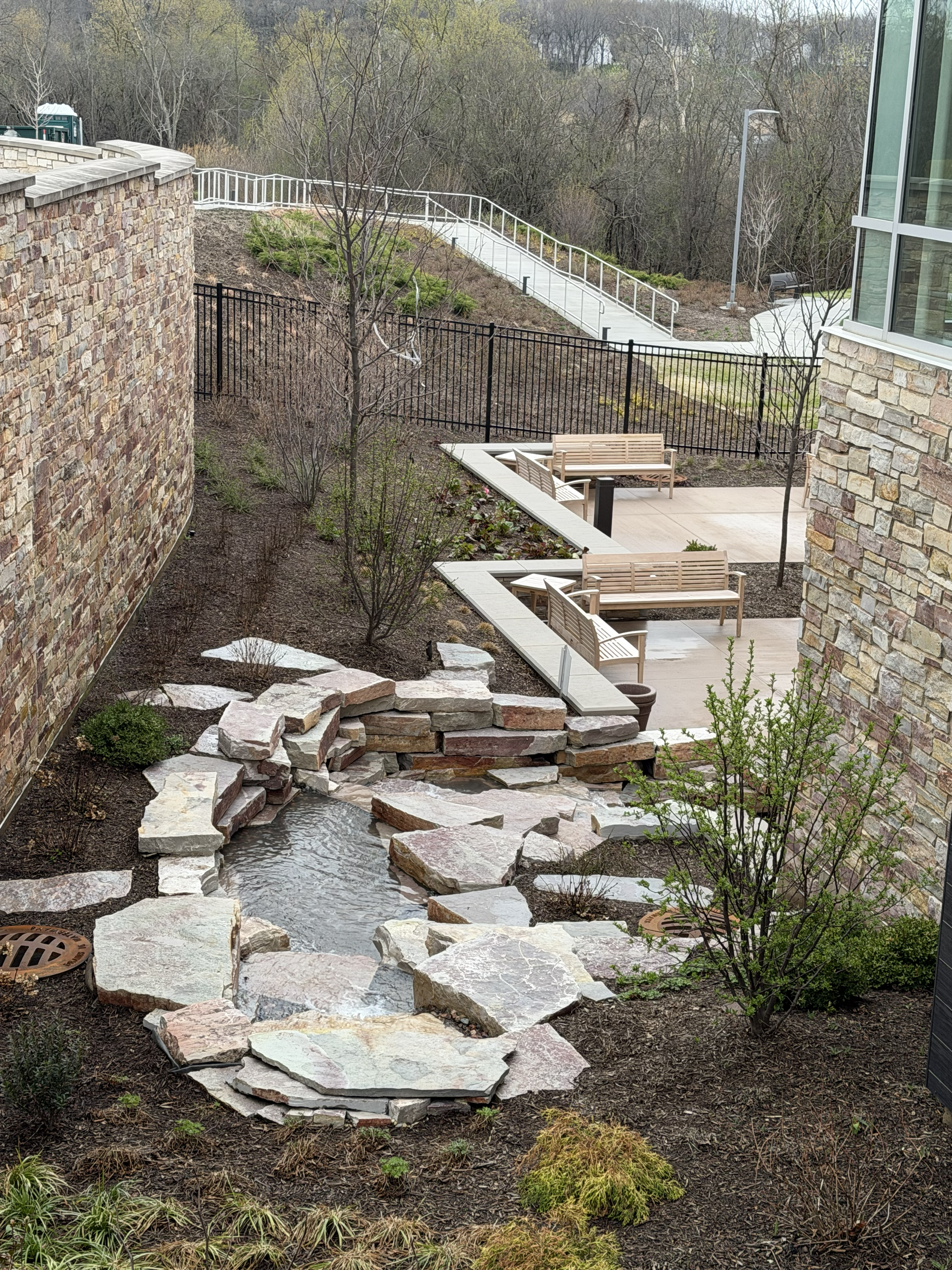 A picture looking down at the waterfall from the main entrance of the library