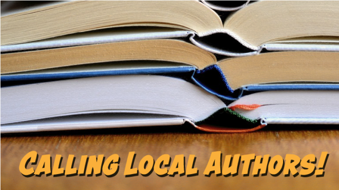 Calling local authors.  Close up view of open books stacked on top of each other
