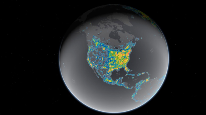 A gray globe showing North America with a blue and yellow heat map showing light polution.
