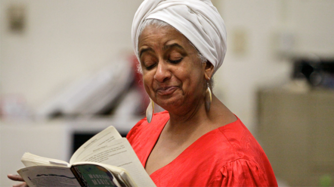 Photograph of a woman reading a book