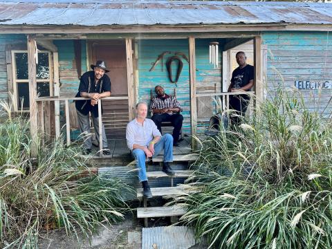 John Primer and the Real Deal Blues Band in front of shack